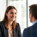 Coaching session with two people talking professionally